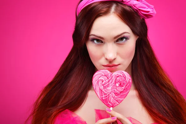 Redheaded girl with  large candy — Stock Photo, Image