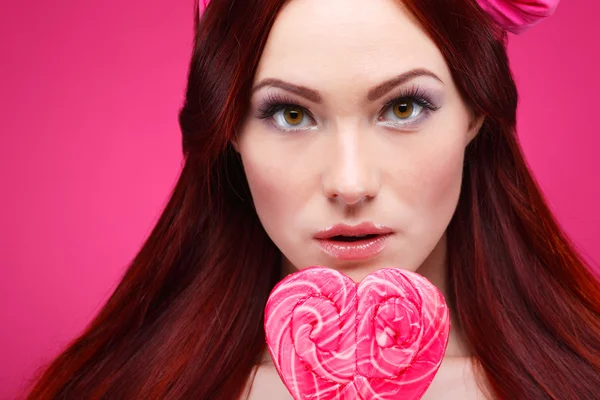 Redheaded girl with  large candy — Stock Photo, Image