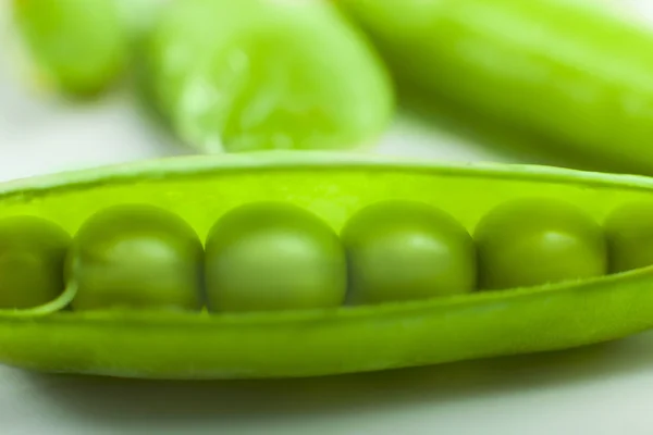 Pods peas on a white — Stock Photo, Image