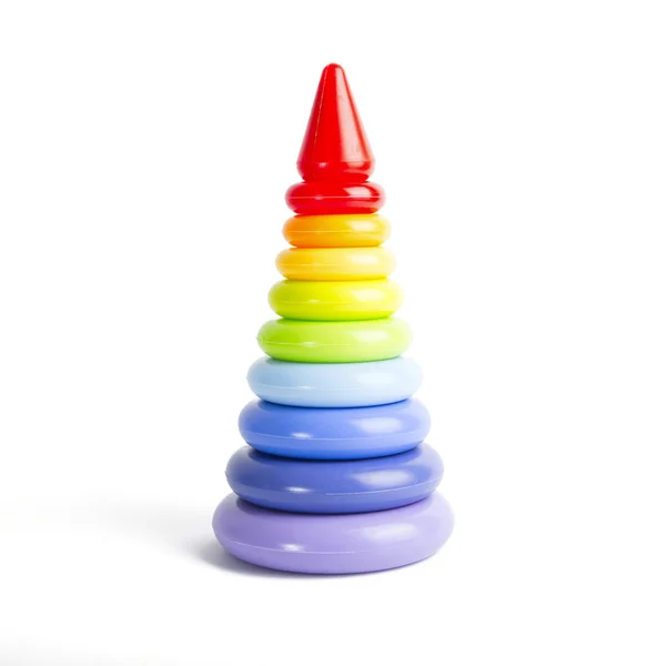 Pyramid build from colorful plastic rings, isolated on white. — Stock Photo, Image