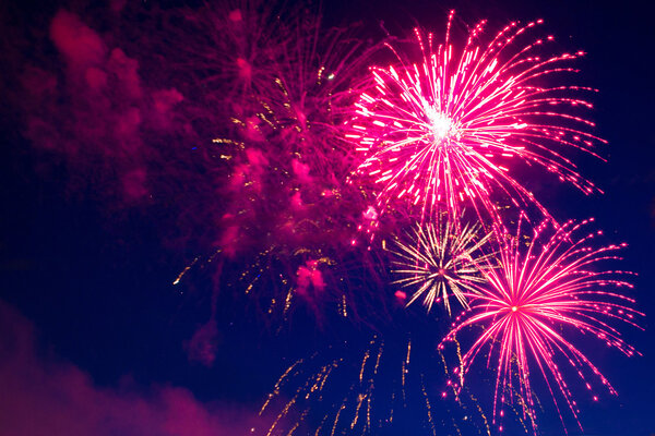 Beautiful colorful holiday fireworks in the evening sky