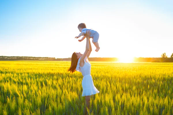 Happy woman with her baby boy on summer sunny day. — Stock Photo, Image