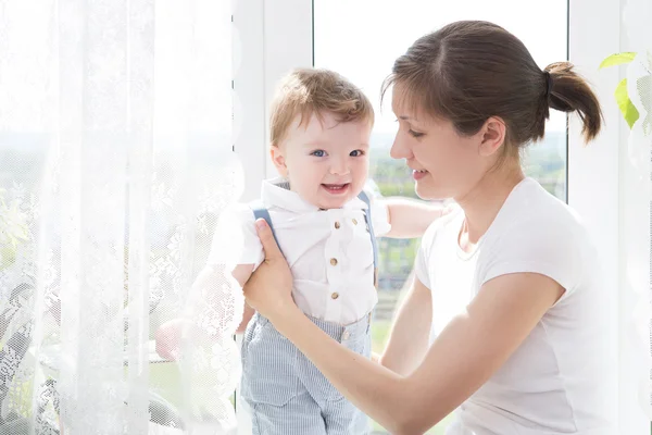 Young mother holding her newborn child. — Stock Photo, Image