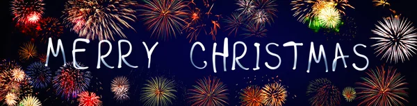 Merry christmas written with Sparkle firework — Stock Photo, Image