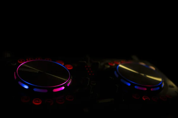 DJ console music party in nightclub