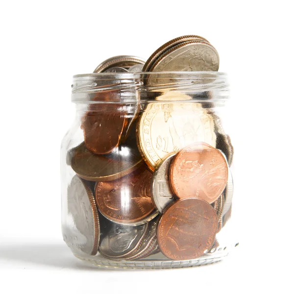 Mason Jar with Coins on White Stock Image