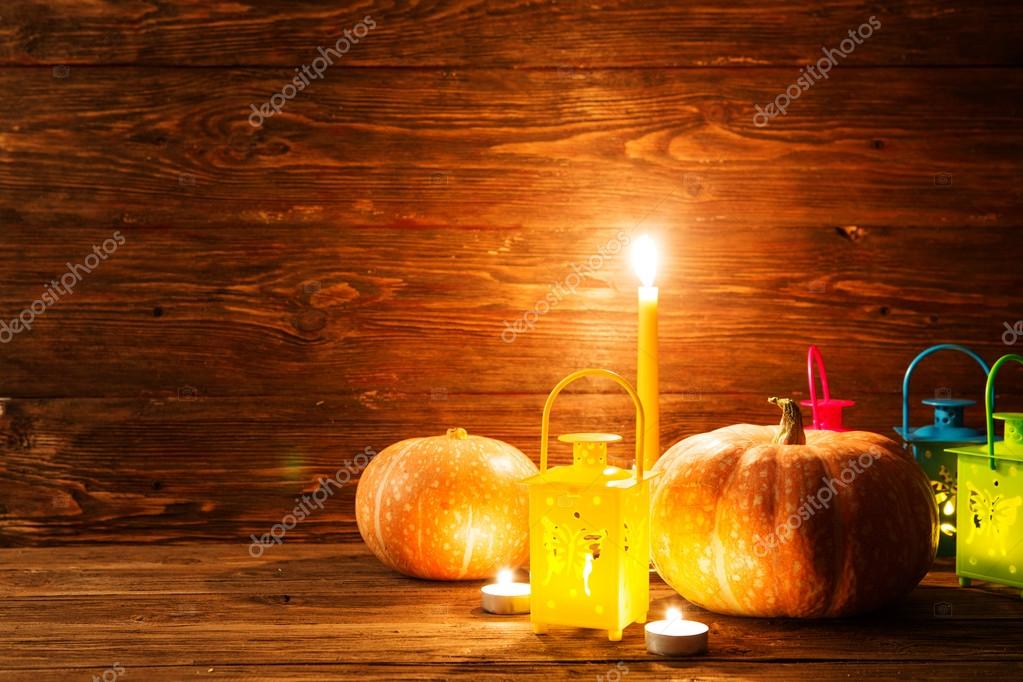 Lantern with burning candles and pumpkins. Greeting Card. Halloween pumpkin background. Halloween. Happy Halloween. Halloween pumpkin