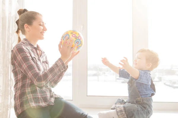 Happy Mother Her Baby Playing Colorful Ball Home Window — Stock Photo, Image