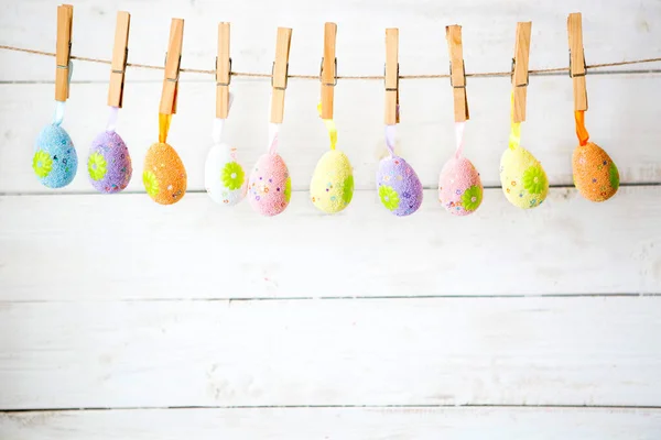 Colorful Easter Eggs Rope White Wooden Background — Stock Photo, Image