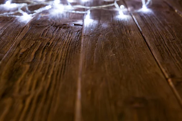 Zářící Pozadí Bokeh Prázdným Dřevěným Stolem Vánoční Pozadí — Stock fotografie