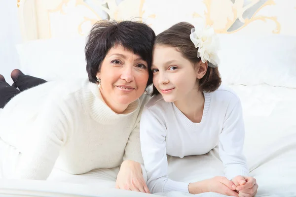 Cute little girl, her mother and grandmother together on this portrait — Stock Photo, Image