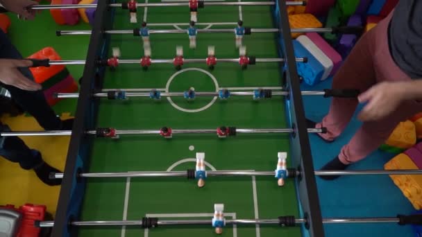 Foosball. Hands of a man playing table football — Stock Video