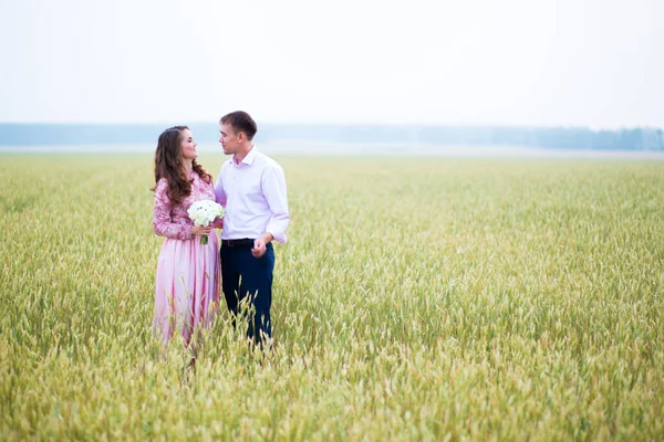 Bride and groom in field. Muslim marriage.