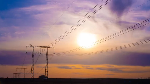 Electric high voltage pole at sunset background — Stock Photo, Image