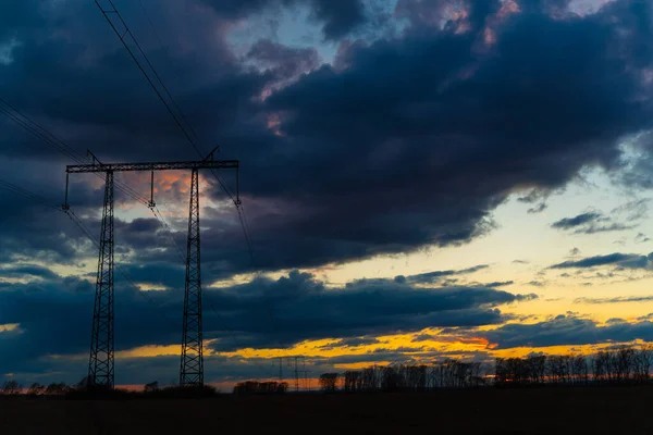 Electric high voltage pole at sunset background — Stock Photo, Image