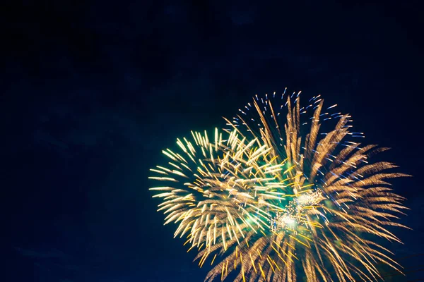 Fireworks on the background of the cloudy night sky. 4th of July - American Independence Day USA — Stock Photo, Image