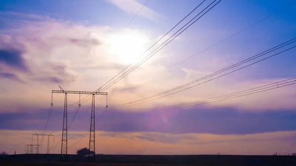 Electric high voltage pole at sunset background — Stock Photo, Image