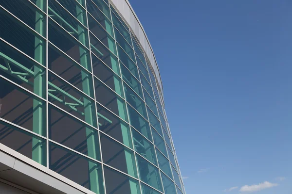 Close-up round office building with blue sky — Stock Photo, Image