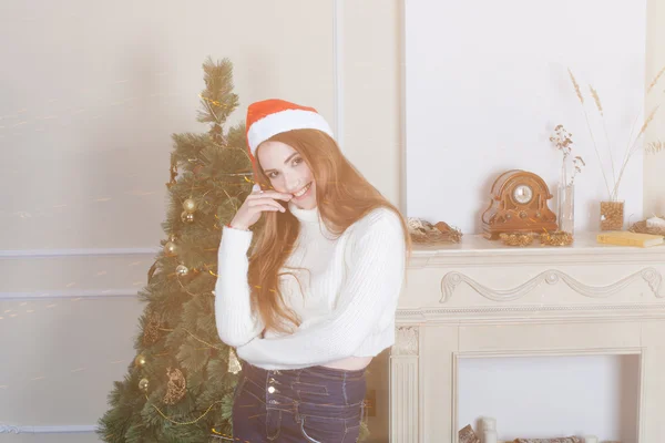 Young girl in santa claus hat — Stock Photo, Image