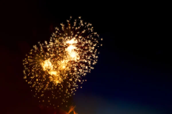 Colorful fireworks over dark sky, displayed during a celebration — Stock Photo, Image