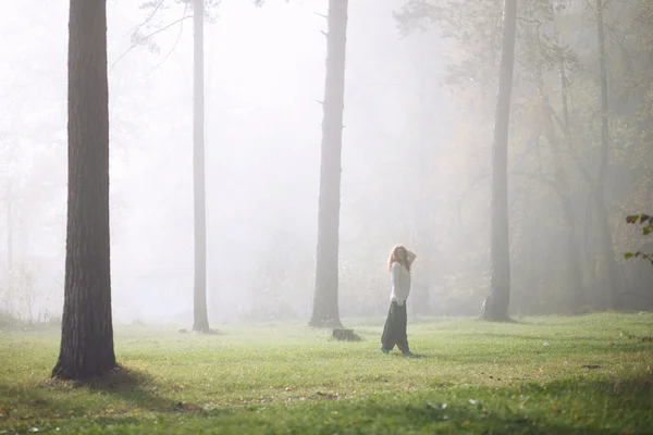 Young girl dancing in the forest — Stock Photo, Image