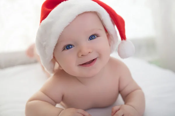 Christmas cute baby boy lying on white soft plaid Royalty Free Stock Images