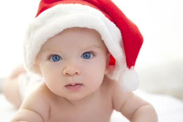 Portrait of a baby boy with santa hat Royalty Free Stock Photos