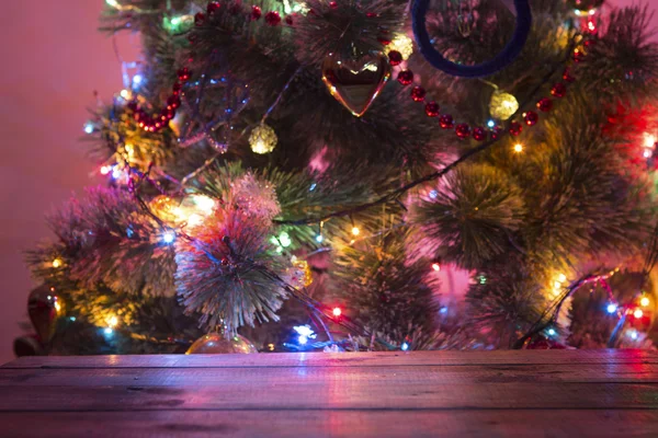 Christmas holiday background with empty wooden deck table over bokeh. — Stock Photo, Image