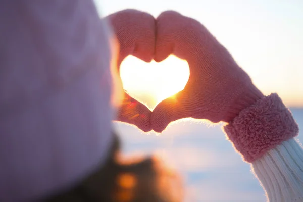 Woman hands in winter gloves Heart symbol — Stock Photo, Image