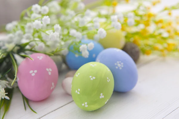 Colorful Easter eggs on wooden background. — Stock Photo, Image