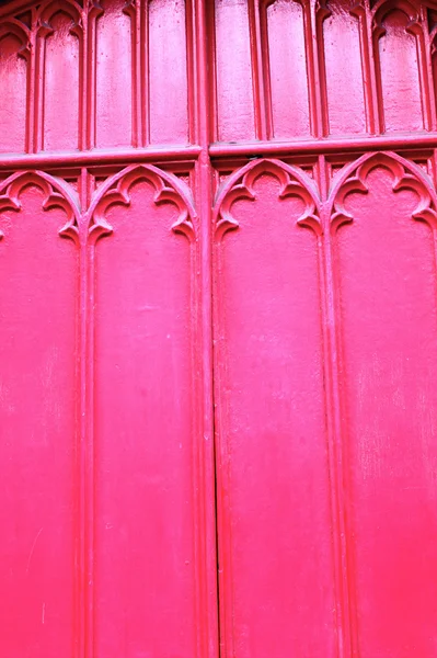 Dřevěné dveře červeného kostela zblízka pozadí — Stock fotografie
