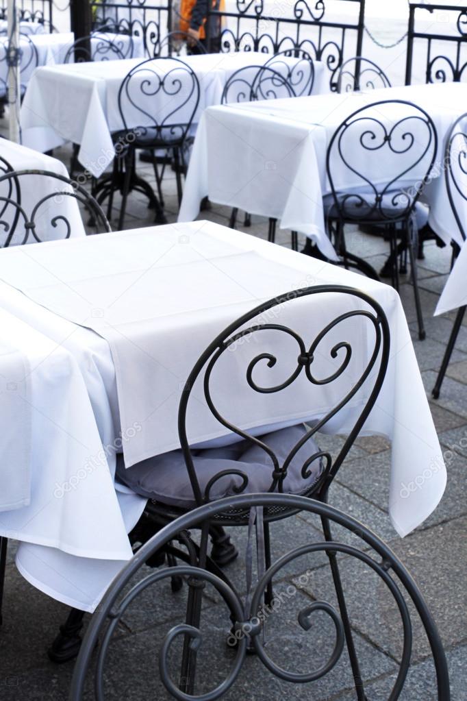 Stylish metal chair and tables at the restaurant