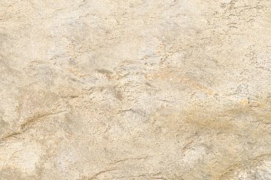 Taş dokusu soyut arka plan. Doğal bej, granit, eski kaya duvar yüzeyinin ayrıntıları.