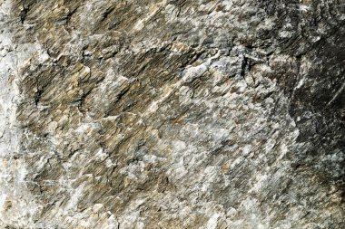Taş dokusu soyut arka plan. Doğal malzeme gri ve beyaz granit duvar yüzeyinin ayrıntıları. Eski kaya yüzeyi. Doğa grunge kaba deseni duvar kağıdı arkaplanı ve herhangi bir desen için kullanılabilir.