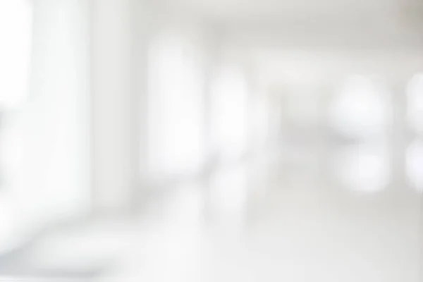 Empty blur white corridor hallway of modern white office building room with entrance door business blur backgroun