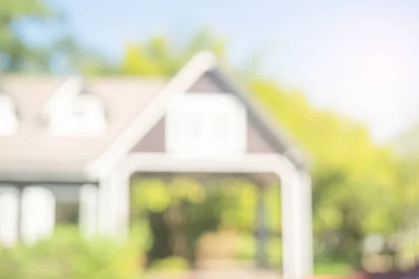 House building blurred background. trees and garden in front of home building, modern house in nature, abstract architecture with green environment concep