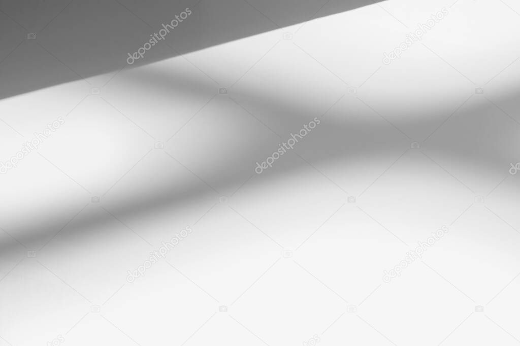 Abstract shadow and striped diagonal light blur background on white wall  from window,  architecture dark gray and sunshine diagonal geometric effect overlay for backdrop and mockup desig