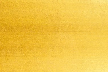 Altın duvar dokusu arka plan. Duvarın yüzeyinde sarı parlak altın folyo, parlak altın renkli duvar kağıdı.