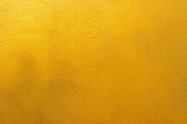 Altın duvar dokusu arka plan. Altın sarısı, parlak altın folyo boya duvarda