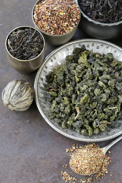 different varieties of dry tea (black, white, green)