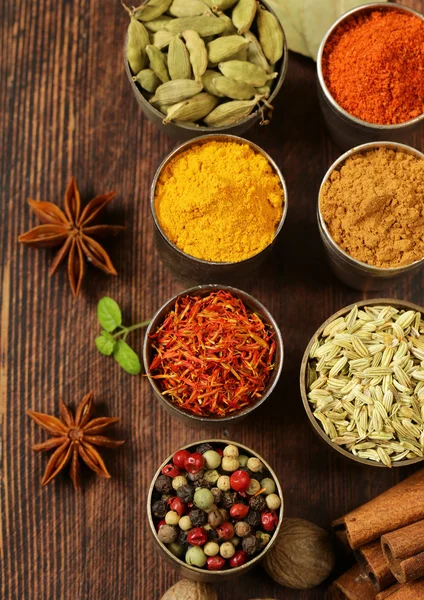 Variety of spices (saffron, paprika, pepper, fennel, cinnamon, turmeric, nutmeg) — Stock Photo, Image