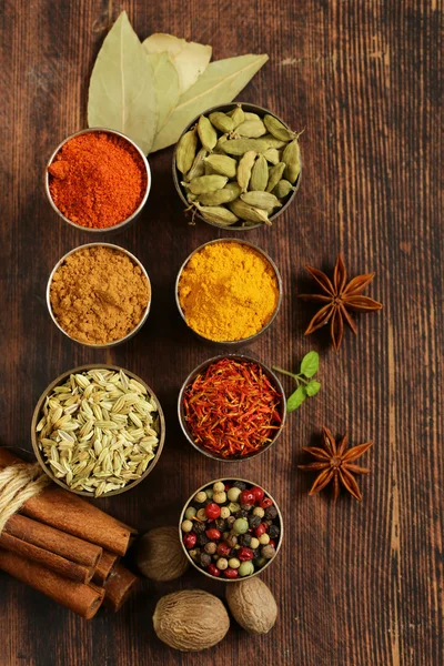 Variety of spices (saffron, paprika, pepper, fennel, cinnamon, turmeric, nutmeg) — Stock Photo, Image