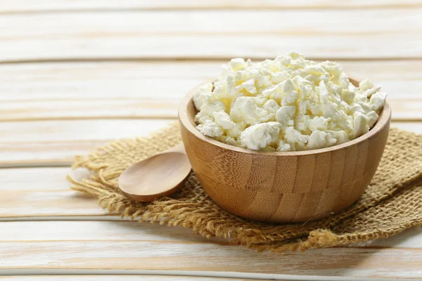 Homemade organic cottage cheese in a wooden bowl — Stock Photo, Image