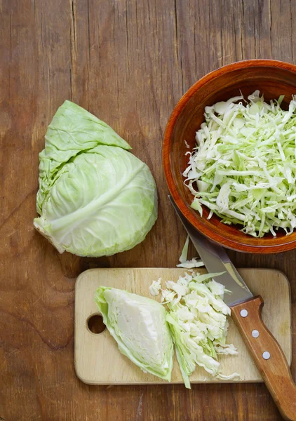 Fresh sliced cabbage on a wooden board — Stock Photo, Image