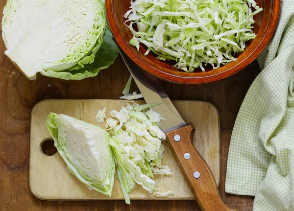 Fresh sliced cabbage on a wooden board — Stock Photo, Image