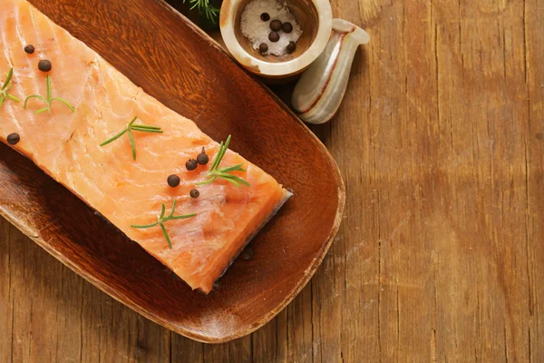 Salty salmon red fish with black pepper and rosemary — Stock Photo, Image