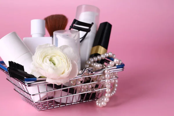 shopping basket with cosmetics and jewelry