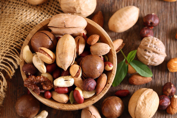 nuts assorted mix on a wooden background