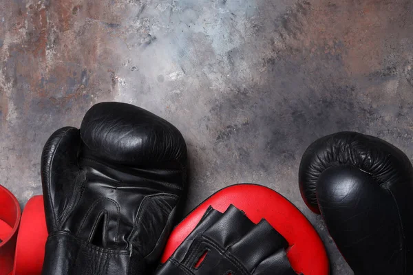 sports equipment for boxing gloves on a dark background