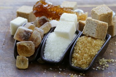 Different types of sugar - brown, white and refined sugar clipart